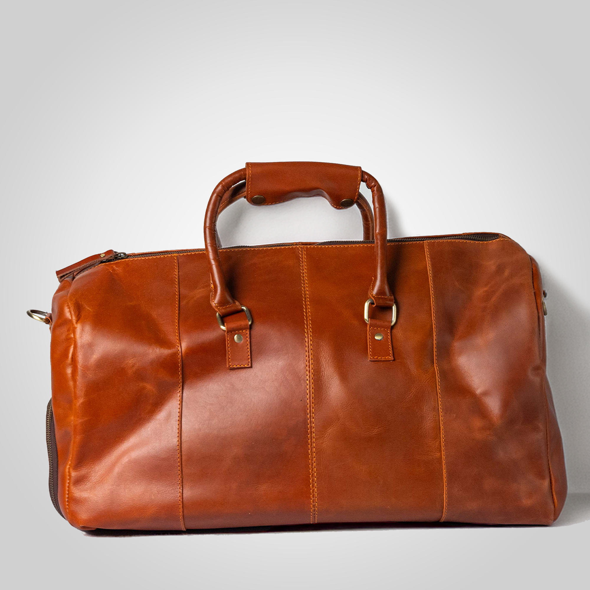 Back view of The Escape handcrafted leather duffle bag with zipper and handles